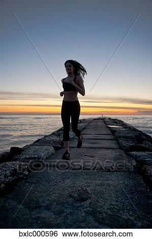 Young Girl Running On A Pier View Large Photo Image Stock Photograph - Young Girl Running On A Pier. Fotosearch