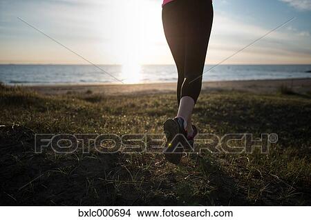 Picture - Young Girl Running On The Beach. Fotosearch
