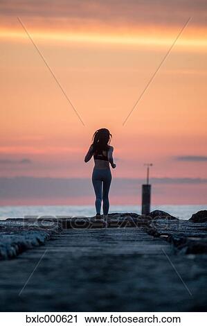 Young Girl Running On The Beach View Large Photo Image Stock Image - Young Girl Running On The Beach. Fotosearch