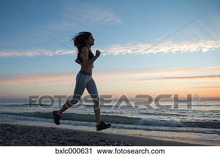 Young Girl Running On The Beach View Large Photo Image Stock Image - Young Girl Running On The Beach. Fotosearch