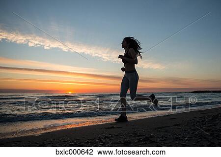 Young Girl Running On The Beach View Large Photo Image Stock Image - Young Girl Running On The Beach. Fotosearch