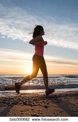 Young Girl Running On The Beach View Large Photo Image Stock Image - Young Girl Running On The Beach. Fotosearch