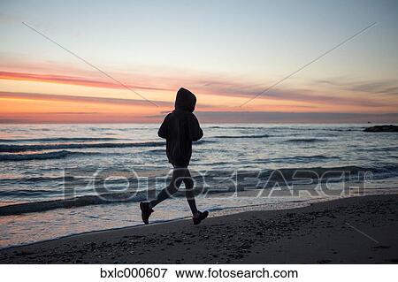 Young Girl Running On The Beach View Large Photo Image Stock Photo - Young Girl Running On The Beach. Fotosearch
