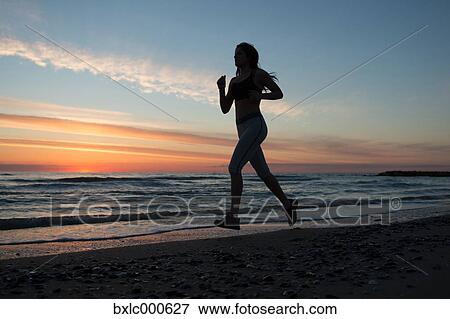 Young Girl Running On The Beach View Large Photo Image Stock Photo - Young Girl Running On The Beach. Fotosearch
