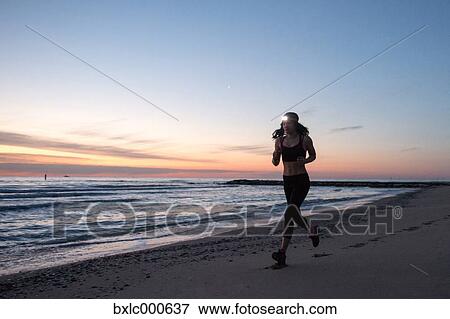 Young Girl Running On The Beach View Large Photo Image Stock Photo - Young Girl Running On The Beach. Fotosearch