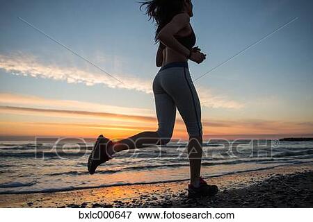 Stock Photo - Young Girl Running On The Beach. Fotosearch
