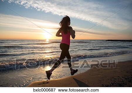 Young Girl Running On The Beach View Large Photo Image Stock Photo - Young Girl Running On The Beach. Fotosearch