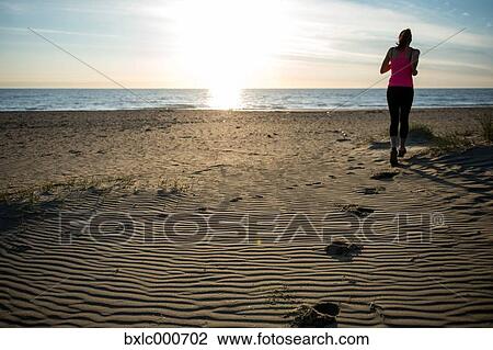 Young Girl Running On The Sand View Large Photo Image Stock Image - Young Girl Running On The Sand. Fotosearch