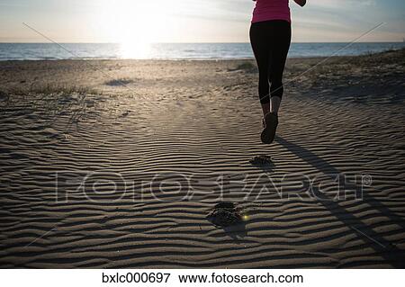 Stock Photo - Young Girl Running On The Sand. Fotosearch