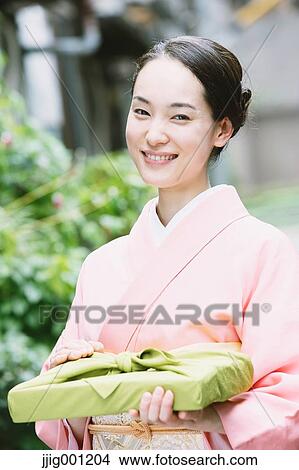 Young Japanese woman in a traditional kimono View Large Photo Image Picture - Young Japanese woman in a traditional kimono. Fotosearch