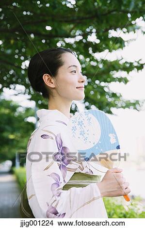 Young Japanese woman in a traditional kimono View Large Photo Image Picture - Young Japanese woman in a traditional kimono. Fotosearch
