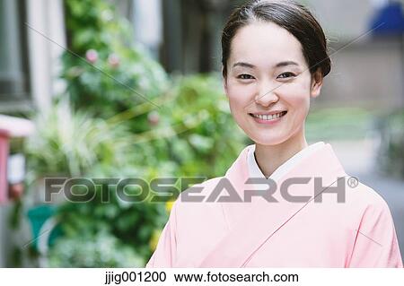 Young Japanese woman in a traditional kimono View Large Photo Image Stock Image - Young Japanese woman in a traditional kimono. Fotosearch