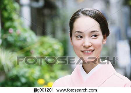 Young Japanese woman in a traditional kimono View Large Photo Image Stock Image - Young Japanese woman in a traditional kimono. Fotosearch