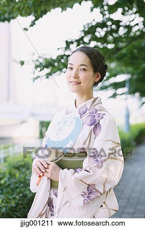 Young Japanese woman in a traditional kimono View Large Photo Image Stock Image - Young Japanese woman in a traditional kimono. Fotosearch