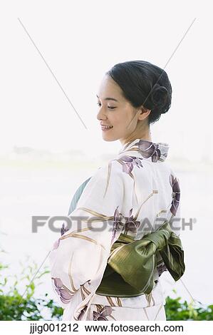 Young Japanese woman in a traditional kimono View Large Photo Image Stock Image - Young Japanese woman in a traditional kimono. Fotosearch