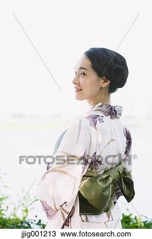 Young Japanese woman in a traditional kimono View Large Photo Image Stock Image - Young Japanese woman in a traditional kimono. Fotosearch