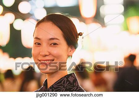 Young Japanese woman in a traditional kimono at a summer festival View Large Photo Image Stock Image - Young Japanese woman in a traditional kimono at a summer festival. Fotosearch