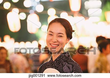 Young Japanese woman in a traditional kimono at a summer festival View Large Photo Image Stock Image - Young Japanese woman in a traditional kimono at a summer festival. Fotosearch