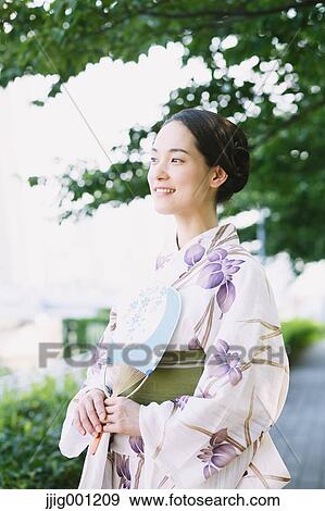 Stock Photo - Young Japanese woman in a traditional kimono. Fotosearch
