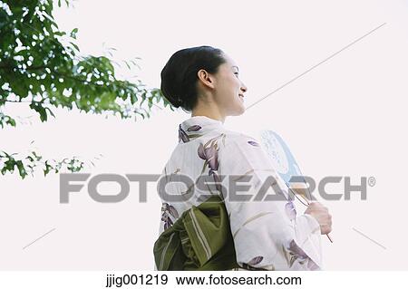 Stock Photo - Young Japanese woman in a traditional kimono. Fotosearch