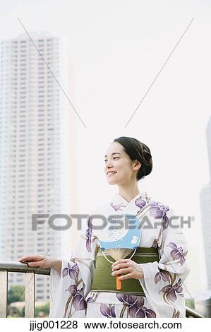 Stock Photo - Young Japanese woman in a traditional kimono. Fotosearch