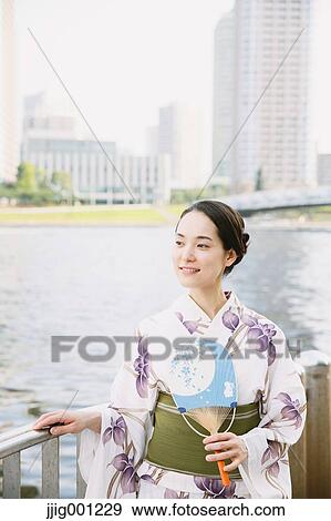 Stock Photo - Young Japanese woman in a traditional kimono. Fotosearch