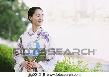 Stock Photograph - Young Japanese woman in a traditional kimono. Fotosearch