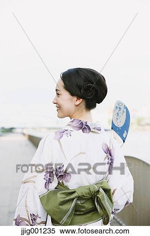 Stock Photography - Young Japanese woman in a traditional kimono. Fotosearch