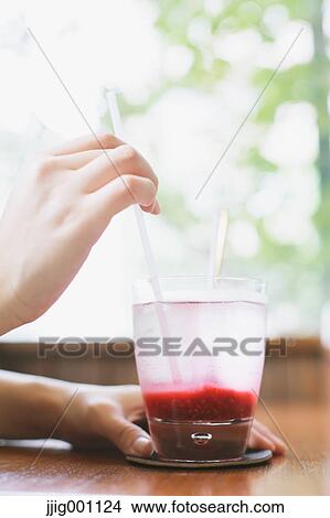 Young Japanese woman with raspberry soda in a cafe View Large Photo Image Picture - Young Japanese woman with raspberry soda in a cafe. Fotosearch