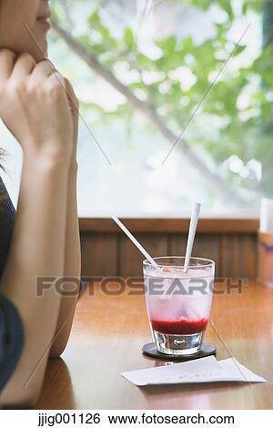 Young Japanese woman with raspberry soda in a cafe View Large Photo Image Stock Photograph - Young Japanese woman with raspberry soda in a cafe. Fotosearch