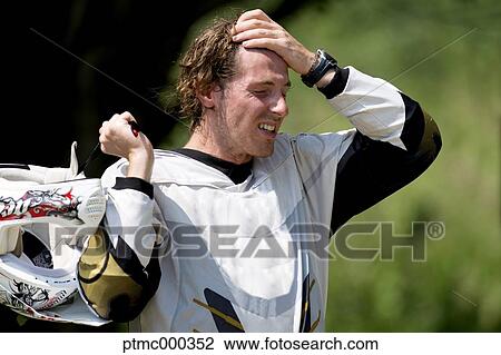 Young Man Relaxing After Riding Dirt Bike View Large Photo Image Stock Image - Young Man Relaxing After Riding Dirt Bike. Fotosearch