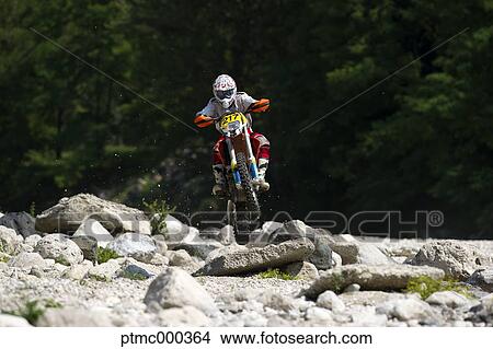 Young Man Riding Motocross Bike in Italian Countryside View Large Photo Image Picture - Young Man Riding Motocross Bike in Italian Countryside. Fotosearch