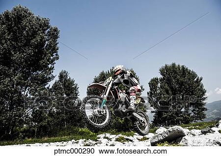 Young Man Riding Motocross Bike in Italian Countryside View Large Photo Image Stock Image - Young Man Riding Motocross Bike in Italian Countryside. Fotosearch