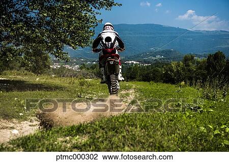 Young Man Riding Motocross Bike in Italian Countryside View Large Photo Image Stock Image - Young Man Riding Motocross Bike in Italian Countryside. Fotosearch