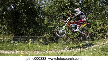 Young Man Riding Motocross Bike in Italian Countryside View Large Photo Image Stock Image - Young Man Riding Motocross Bike in Italian Countryside. Fotosearch