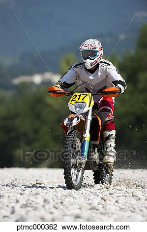 Young Man Riding Motocross Bike in Italian Countryside View Large Photo Image Stock Image - Young Man Riding Motocross Bike in Italian Countryside. Fotosearch