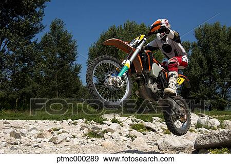 Young Man Riding Motocross Bike in Italian Countryside View Large Photo Image Stock Photo - Young Man Riding Motocross Bike in Italian Countryside. Fotosearch