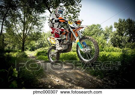 Young Man Riding Motocross Bike in Italian Countryside View Large Photo Image Stock Photo - Young Man Riding Motocross Bike in Italian Countryside. Fotosearch