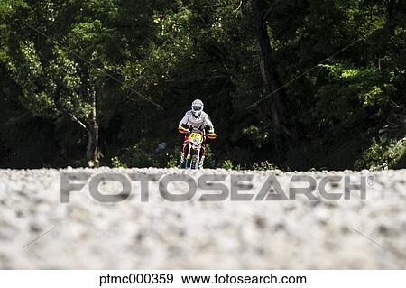 Young Man Riding Motocross Bike in Italian Countryside View Large Photo Image Stock Photo - Young Man Riding Motocross Bike in Italian Countryside. Fotosearch