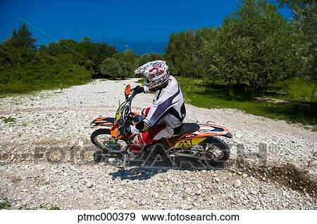 Young Man Riding Motocross Bike in Italian Countryside View Large Photo Image Stock Photo - Young Man Riding Motocross Bike in Italian Countryside. Fotosearch