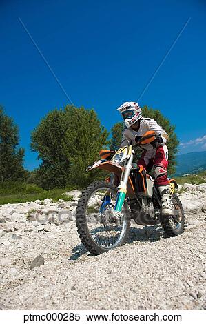 Young Man Riding Motocross Bike in Italian Countryside View Large Photo Image Stock Photography - Young Man Riding Motocross Bike in Italian Countryside. Fotosearch