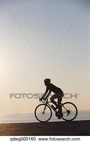 Stock Image - Young Japanese girl cycling. Fotosearch