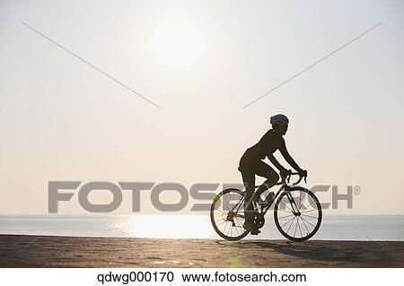 Stock Image - Young Japanese girl cycling. Fotosearch