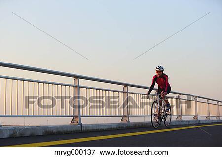 Young Japanese girl cycling View Large Photo Image Stock Photo - Young Japanese girl cycling. Fotosearch