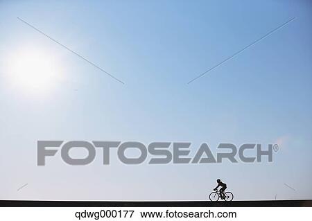 Stock Photo - Young Japanese girl cycling. Fotosearch