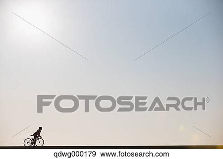 Stock Photo - Young Japanese girl cycling. Fotosearch