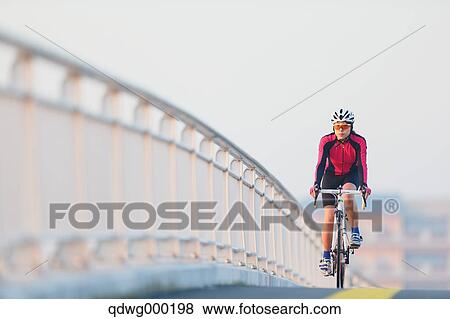 Stock Photo - Young Japanese girl cycling. Fotosearch