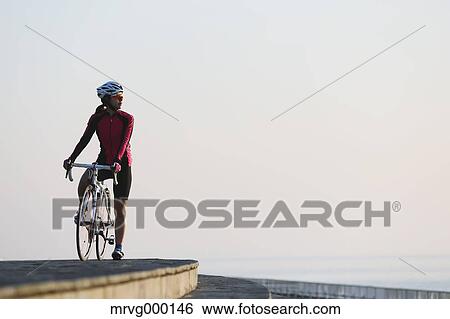 Young Japanese girl cycling View Large Photo Image Stock Photograph - Young Japanese girl cycling. Fotosearch