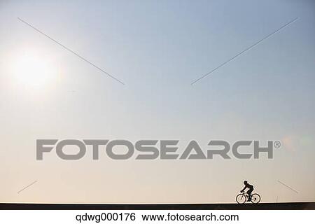 Stock Photograph - Young Japanese girl cycling. Fotosearch
