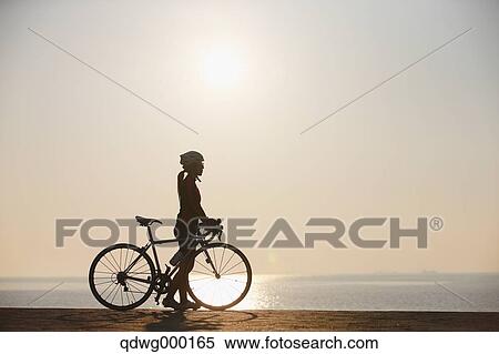 Stock Photography - Young Japanese girl cycling. Fotosearch